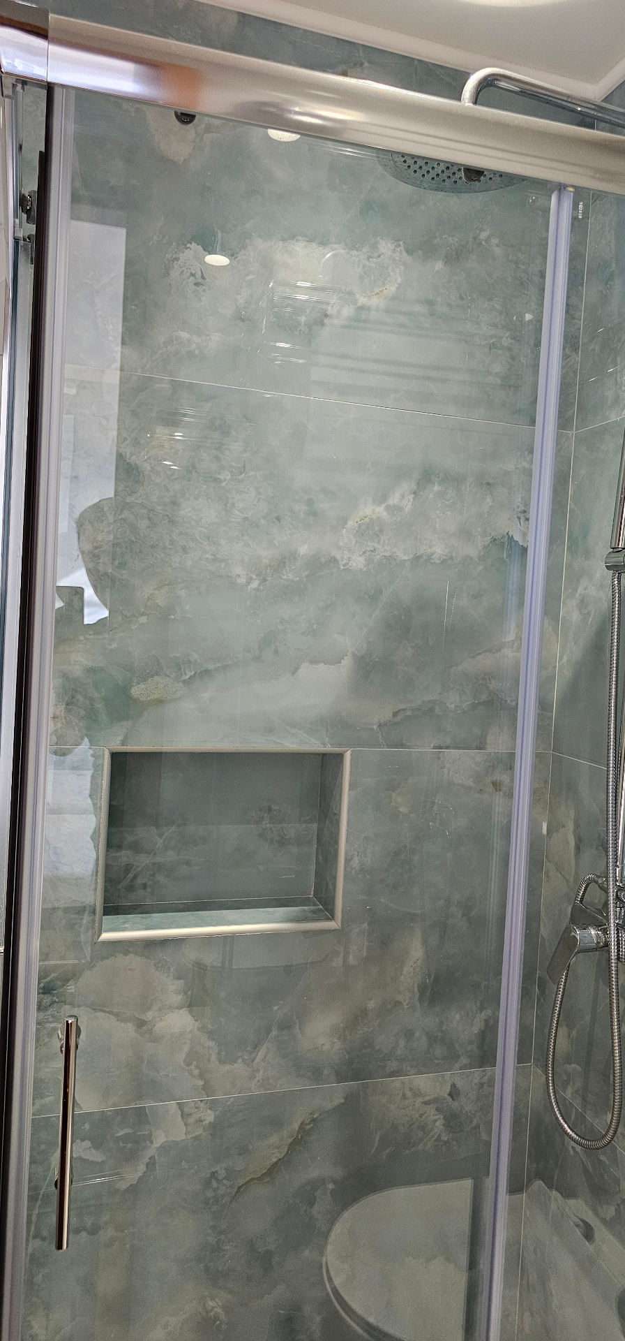 Shower with marble tiling